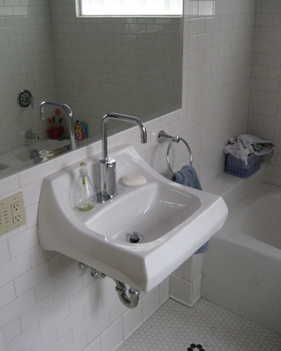 A smaller sink is added to the kids bath remodel to maximize space usage
