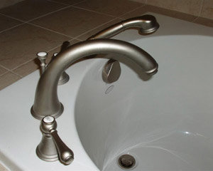 New fixtures and high-quality tile finish off the bathroom remodel by seattle custom home builder