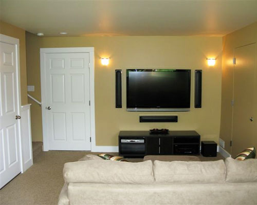 This basement room becomes a media room as well, with all of the bells and whistles required for the flat screen and low voltage accessories