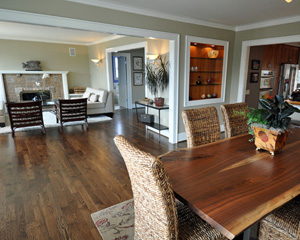 The old mix-matched floors are replaced with a wider plank white oak stained a deep brown.  Elegant and rock-solid with a new subfloor, the floor extend throughout the main level, only skipping the original powder bath and its vintage hex tile floors