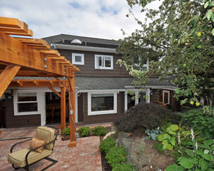 After: Hard to believe it's the same home with added dormer space and a more functional main floor plan and doors