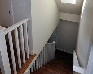 The new configuration includes a safe railing and handrail and a skylight, plus new treads and other finishes