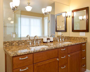 A roomy double vanity and lots of mirrors make this master bathroom feel more like a spa
