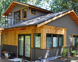 careful placement of backyard cottage among mature cedars and a huge maple trees in Seattle