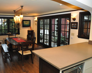 The addition also affords space for a dining room, which includes a beautiful 4-panel Loewen sliding door system.  It provides open access from the rear of the home into the beautiful garden and fire pit areas
