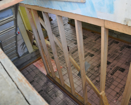 A new stairwell was created on the exterior of the home to provide private access and egress from the basement bedroom