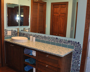 This bathroom facelift (no walls were moved) is both value-priced and makes a huge difference in how the bathroom looks and feels.  It's now a cool and colorful oasis