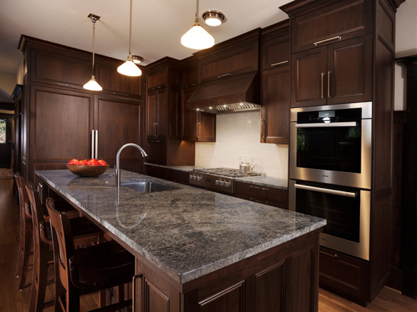 walnut custom kitchen cabinets with Azul Aran granite counters